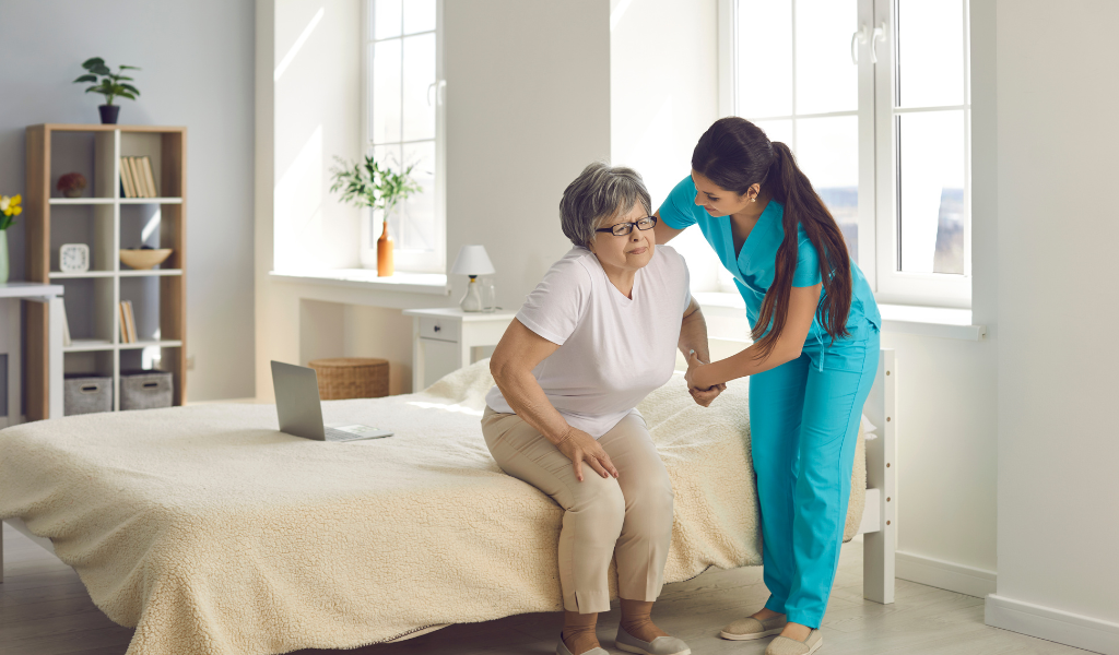 a nurse helping a senior lady