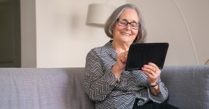 old lady looking at a tabet